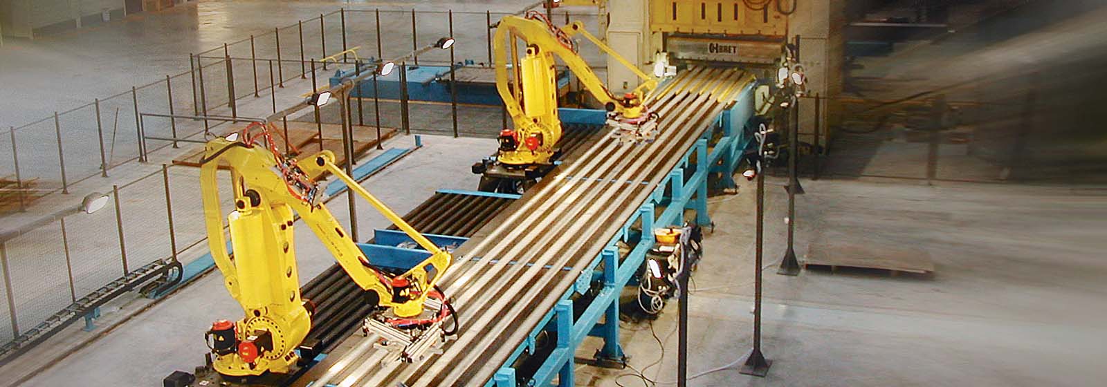 Two M-410 robots handling large metal sheets