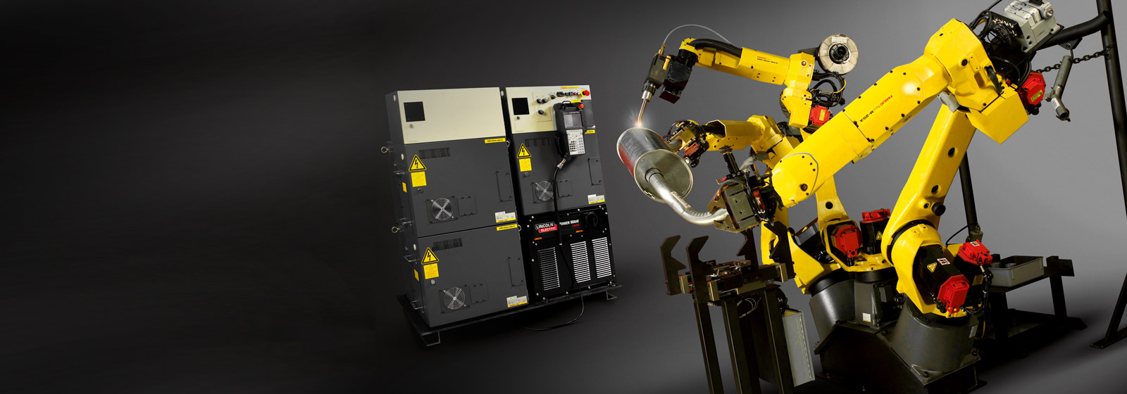 Three welding robots and control units